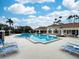 Inviting community pool with lounge chairs at 3264 River Branch Cir, Kissimmee, FL 34741