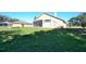 Large backyard with screened patio and grassy area at 3330 Earle Ct, Kissimmee, FL 34746