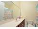 Bathroom with single vanity and shower/tub combo at 3330 Earle Ct, Kissimmee, FL 34746