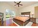 Main bedroom with wood flooring and large sliding doors leading to the patio at 3330 Earle Ct, Kissimmee, FL 34746