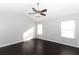 Spacious bedroom with dark hardwood floors and a ceiling fan at 3473 Hillmont Cir, Orlando, FL 32817