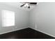 Spacious bedroom with dark hardwood floors and ceiling fan at 3473 Hillmont Cir, Orlando, FL 32817