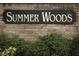 Summer Woods community entrance sign, black with gold lettering at 3473 Hillmont Cir, Orlando, FL 32817