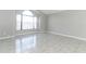 Spacious living room with tile flooring and a large window at 3473 Hillmont Cir, Orlando, FL 32817