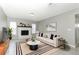 Living room with fireplace, neutral colored couch, and coffee table at 3473 Hillmont Cir, Orlando, FL 32817