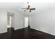 Main bedroom with dark hardwood floors and access to bathroom at 3473 Hillmont Cir, Orlando, FL 32817