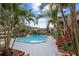 Inviting community pool surrounded by palm trees at 425 Wymore Rd # 203, Altamonte Springs, FL 32714