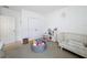 bedroom with crib and toys at 429 Tisone Ln, Davenport, FL 33837