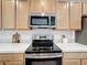 Stainless steel microwave above a stylish range at 429 Tisone Ln, Davenport, FL 33837