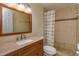 Bathroom with wood vanity and tile shower/tub combo at 4355 E Michigan St # 4355, Orlando, FL 32812