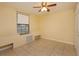 Bedroom with tile floors and a ceiling fan at 4355 E Michigan St # 4355, Orlando, FL 32812