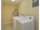 Laundry room with washer, dryer, and water heater at 4355 E Michigan St # 4355, Orlando, FL 32812