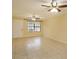 Bright living room with tile floors and ceiling fans at 4355 E Michigan St # 4355, Orlando, FL 32812