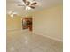 Open concept living room with kitchen view and tile floors at 4355 E Michigan St # 4355, Orlando, FL 32812