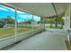 Screened porch with view of backyard and partial street view at 4355 E Michigan St # 4355, Orlando, FL 32812