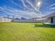 Sunny backyard with shade sail and fence at 4462 Lions Gate Ave, Clermont, FL 34711