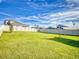 Fenced backyard with a shade sail at 4462 Lions Gate Ave, Clermont, FL 34711