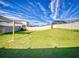 Large backyard with shade sail and fence at 4462 Lions Gate Ave, Clermont, FL 34711