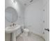 Simple, clean bathroom with pedestal sink and toilet at 4462 Lions Gate Ave, Clermont, FL 34711