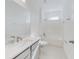 White bathroom with a bathtub, shower, and vanity at 4462 Lions Gate Ave, Clermont, FL 34711