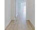 Bright hallway with light wood-look flooring at 4462 Lions Gate Ave, Clermont, FL 34711