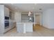 Modern kitchen with gray cabinets and stainless steel appliances at 4462 Lions Gate Ave, Clermont, FL 34711