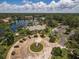 Aerial view of community clubhouse, pool, and parking lot at 4847 Shoreline Cir, Sanford, FL 32771