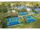 Aerial view of community amenities including tennis and pickleball courts at 4847 Shoreline Cir, Sanford, FL 32771