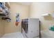 Convenient laundry room with washer, dryer, and storage shelves at 4847 Shoreline Cir, Sanford, FL 32771