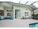 Cozy patio with seating area adjacent to the pool at 4847 Shoreline Cir, Sanford, FL 32771