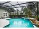 Inviting screened pool and spa area, perfect for relaxation at 4847 Shoreline Cir, Sanford, FL 32771