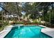 Relaxing screened pool and spa with lush landscaping at 4847 Shoreline Cir, Sanford, FL 32771