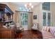 Cozy sitting area with hardwood floors and antique furniture at 4847 Shoreline Cir, Sanford, FL 32771