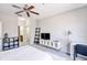 Bright bedroom with a bed, TV, and workspace at 4897 Cypress Woods Dr # 6303, Orlando, FL 32811