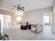 Spacious living room with comfortable seating and neutral carpeting at 4897 Cypress Woods Dr # 6303, Orlando, FL 32811