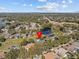 Wide shot showing the home's location near a lake at 6541 Fairway Hill Ct, Orlando, FL 32835