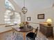 Elegant dining room with a dark wood table and chandelier at 6541 Fairway Hill Ct, Orlando, FL 32835