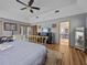 Main bedroom with brass bed frame and en-suite bathroom at 6541 Fairway Hill Ct, Orlando, FL 32835