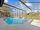 Large, refreshing pool with a screened patio at 6541 Fairway Hill Ct, Orlando, FL 32835