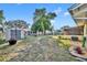 Large backyard with storage shed and room for gardening at 720 E Iris Dr, Orange City, FL 32763