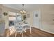 Charming dining area with a white table and chairs, near sliding doors at 720 E Iris Dr, Orange City, FL 32763