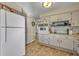 Kitchen with white appliances and ample counter space at 720 E Iris Dr, Orange City, FL 32763