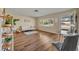 Living room with hardwood floors, sofa, and large window at 720 E Iris Dr, Orange City, FL 32763