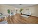 Bright living room with hardwood floors and comfy seating at 720 E Iris Dr, Orange City, FL 32763