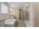 Elegant bathroom with soaking tub, walk-in shower, and granite vanity at 8324 Vivaro Isle Way, Windermere, FL 34786