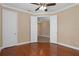 Bedroom with hardwood floors and double doors leading to another room at 8324 Vivaro Isle Way, Windermere, FL 34786