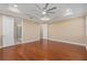 Bright bedroom featuring hardwood floors and access to a bathroom at 8324 Vivaro Isle Way, Windermere, FL 34786