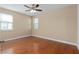 Large bedroom with hardwood floors, ceiling fan and windows at 8324 Vivaro Isle Way, Windermere, FL 34786