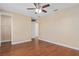 Bright bedroom featuring hardwood floors and walk-in closet at 8324 Vivaro Isle Way, Windermere, FL 34786