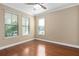 Spacious bedroom with hardwood floors and large windows at 8324 Vivaro Isle Way, Windermere, FL 34786